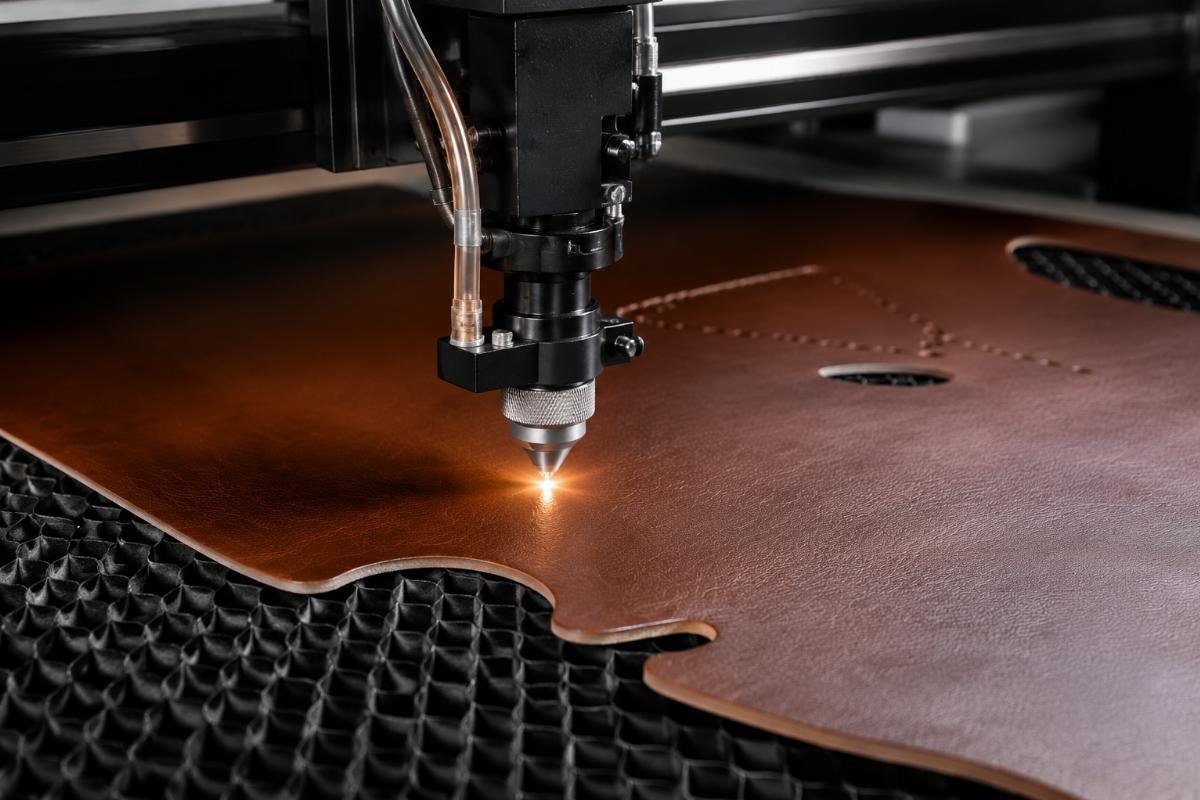 CNC cutting machine processing genuine leather with clean, burr-free edges